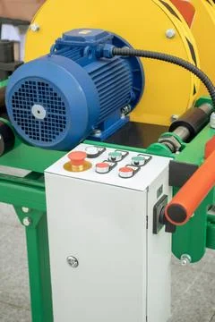 Control panel of a heavy-duty winch machine in a workshop setting showcasin.. Stock Photos