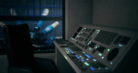 Control panel illuminated in a futuristic environment with robotic elements Stock Footage 318598009