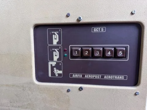 Control panel of an industrial machine featuring buttons and icons for oper.. 库存照片