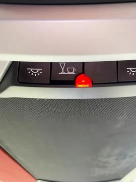 Control panel inside a bus featuring illuminated warning lights for passenger Stock Photos