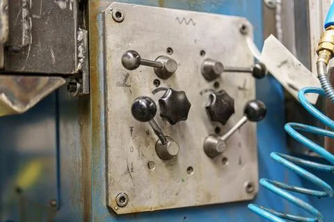 Control panel with knobs and levers used for machine operation in a worksho.. 写真素材
