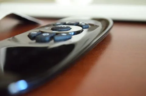 The control panel lies on the table Stock Photos