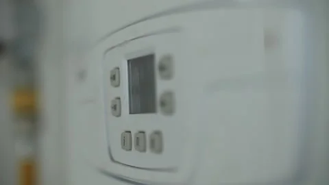 Control panel of a modern gas boiler in focus Stock Footage 311462270