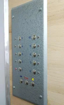 Control panel in a multi-story building elevator Stock Photos