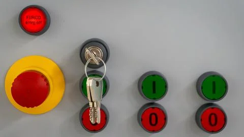 Control panel with red and green buttons and key Stock Photos