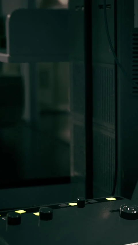 Control panel shows buttons in a lab setting with low light at night Stock Footage 337958497