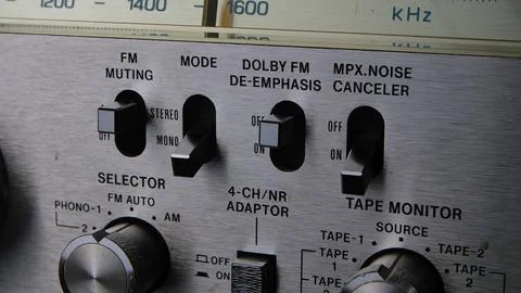 Control panel with toggle switches, knobs and buttons on a retro turntable in Foto stock