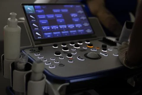 The control panel of the ultrasonic device during the study. In a dark room, the Stock Photos