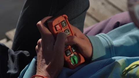  control panel, wakeboard system. cables over water. in hand, close up Stock Footage 142825376