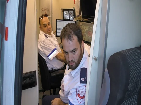 Control paramedics work in strategic Ambulance during fires in Haifa, Israel. Stock Footage 70009327