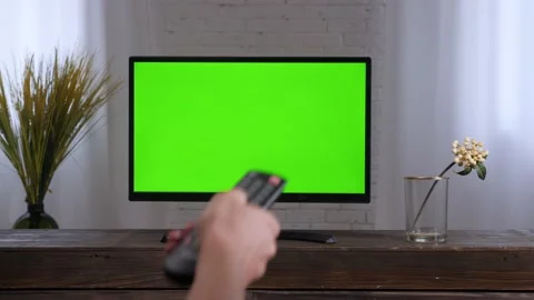 Control remote hand changing channels TV screen plasma panel. Smart television 動画素材 165083910