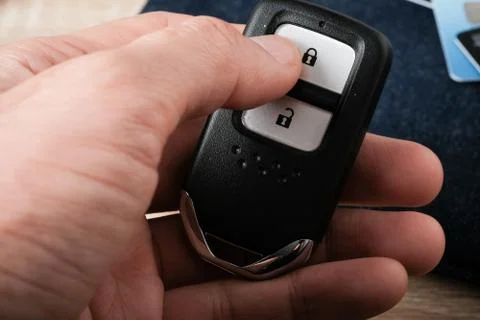 Control remote key holding in hand Stock Photos