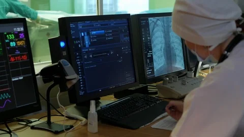 In the control room assistant surgeon watching the progress of cardio surgery Stock Footage 72693465