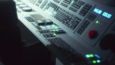 Control room with computers and buttons in a dark setting at night Stock Footage 344965711
