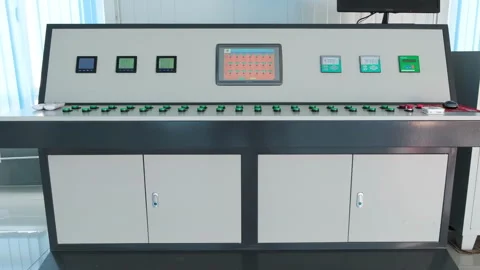 Control room dashboard monitors and table with many buttons sensors and dials Stock Footage 317143249