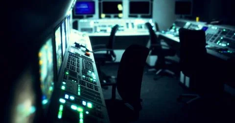 Control room with illuminated panels and empty chairs in dim lighting Stock Illustration