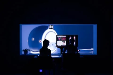 In Control Room Radiologist Diagnosis while Watching Procedure and Monitors.. Stock Illustration