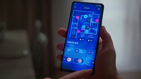 Control smart home devices with a phone app: sensors, appliances, network Stock Footage 318430284