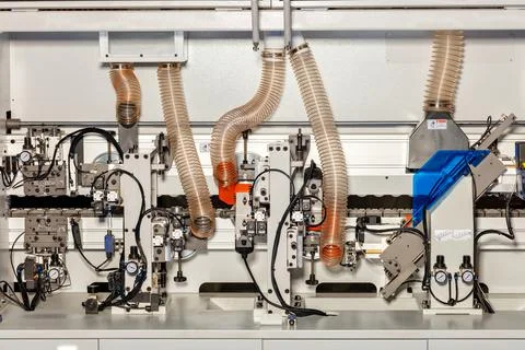 Control system and internal mechanisms for removing sawdust on a modern woodw Stock Photos