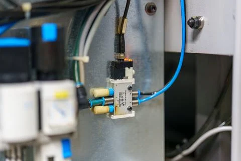 Control system components in a close-up view showing valves, wires, and con.. 库存照片