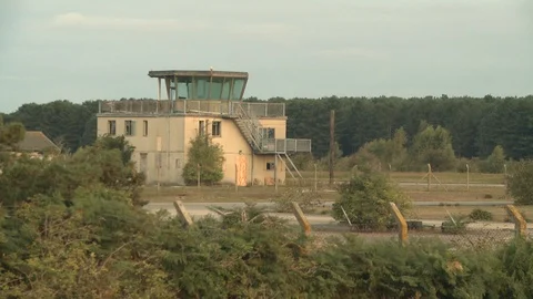 Control tower at abandoned USAF base early morning Stock Footage
