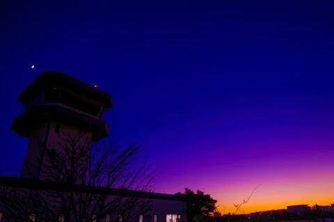 Control tower and crescent moon (Chofu Airport) Stock Photos