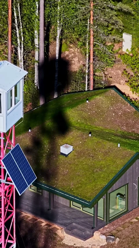 Control tower near mossy rooftop woodland house Stock Footage 336761517