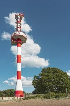 Control tower with radar antennas and navigation equipment on ground agains b Stock Photos