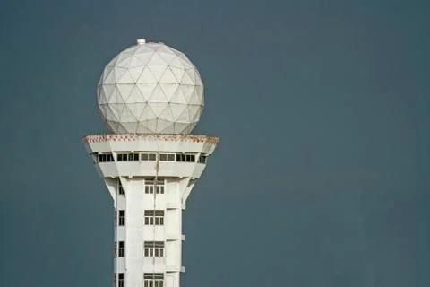 The control tower is white. With a gray background Stock Photos