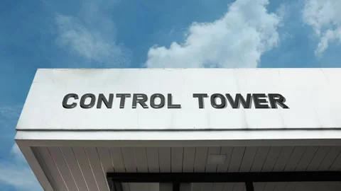 Control tower word sign displayed on building with blue sky background Stock Footage 318587396