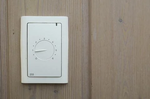 Control for underfloor heating on a pine panel, Denmark, September 20, 2022 Stock Photos