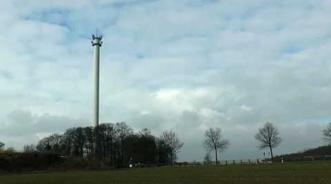 Controlled blasting and demolition operation of a tall radio tower Stock Footage 21221064