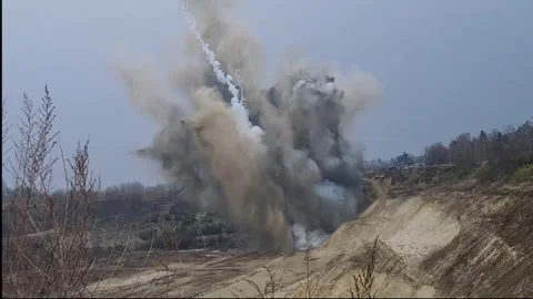 Controlled Explosion of Ordnance in Open Quarry Stock Footage 322222984