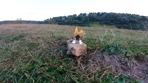 A controlled fire in a natural setting outdoors Video stock 93378501