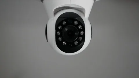 Controlled security camera moving, gray background. Home and office surveillance 127038091