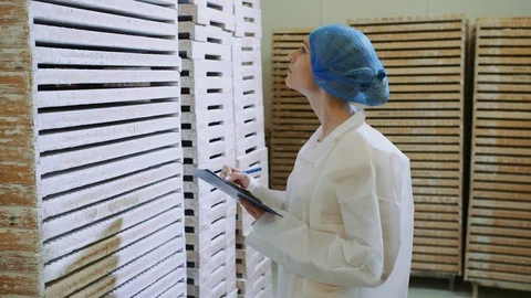 Controller checking factory entrepot. Stock Footage 98027133