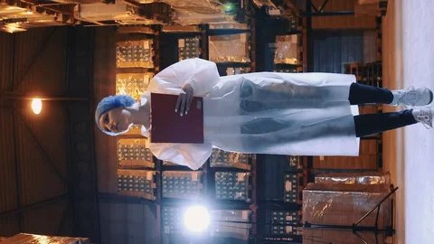 Controller checking factory storage room. Stock Footage 129875855