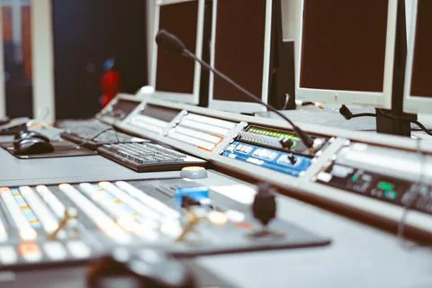 Controller machine and man hand editing or adjusting color on digital video Stock Photos