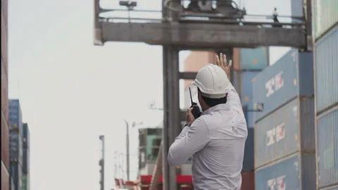 Controller or worker Control of Machine for moving container in export industry. Stock Footage 135898995