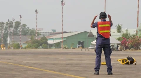 Controller signals landed f-5 fighter plane,Ubon Ratchathani,Thailand Stock Footage 58889869