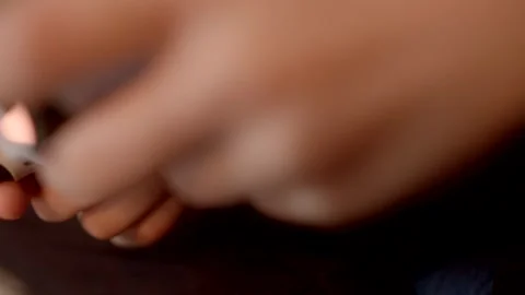 Controller videogames An individual is interacting with a tablet device while it Stock Footage 295932428