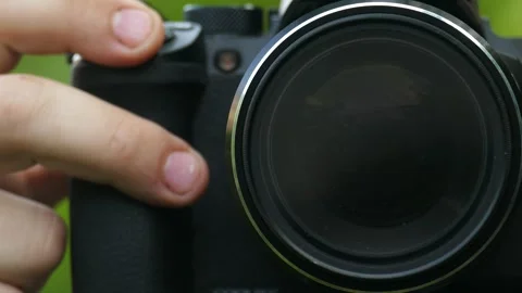 Controlling camera functions for photography or videography. 動画素材 311578221
