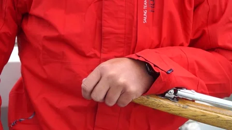 Controlling the Course Close-Up View of a Sailor Adjusting Lines on a Yacht in Stock Footage 304927939