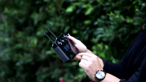 CONTROLLING DRONE WITH REMOTE Stock Footage 162633330