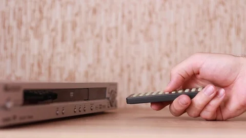 Controlling DVD player with remote control Stock Footage 88245105