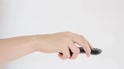 Controlling Entertainment. Hand use remote control on white background Видео 285360268