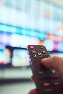 Controlling entertainment with a remote Stock Photos
