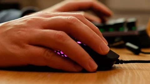 Controlling the game using a modern gaming rgb mouse and a mini keypad. Stock-Footage 164932501