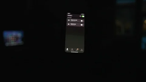 Controlling home lights wirelessly using smartphone / Smart Home Features Stock Footage 103184930