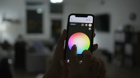 Controlling home lights wirelessly using smartphone / Smart Home Features Stock Footage 103184949